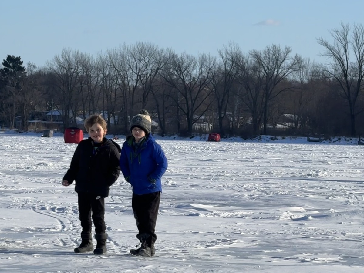 Julian and Emery standing on frozen Buckeye Lake