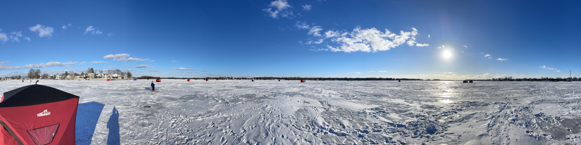 Panoramic view of Buckeye Lake with anglers and shanties on the ice