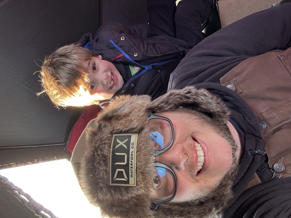Joey in DUX Waterfowl hat with Emery in the shelter